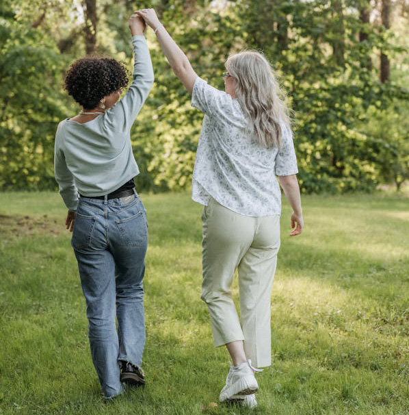 Image of a two women holding hands